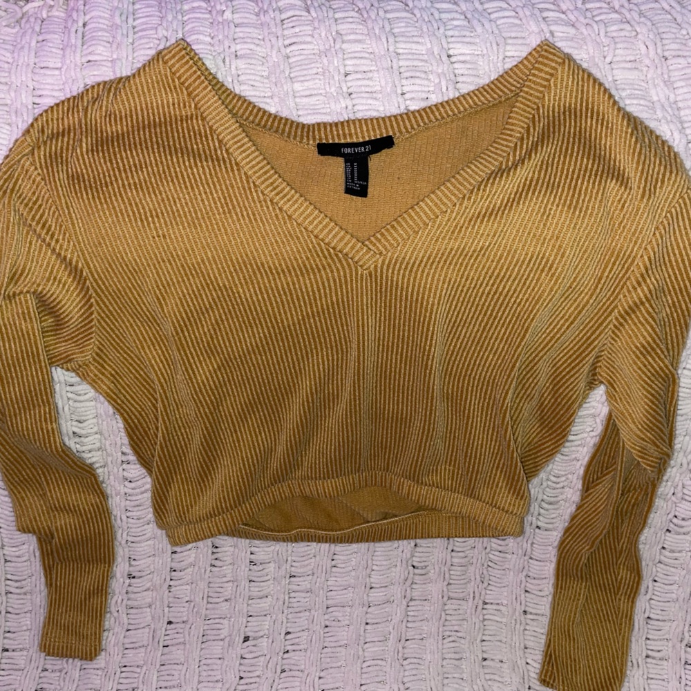 Two long sleeve blouses. Used. Size small